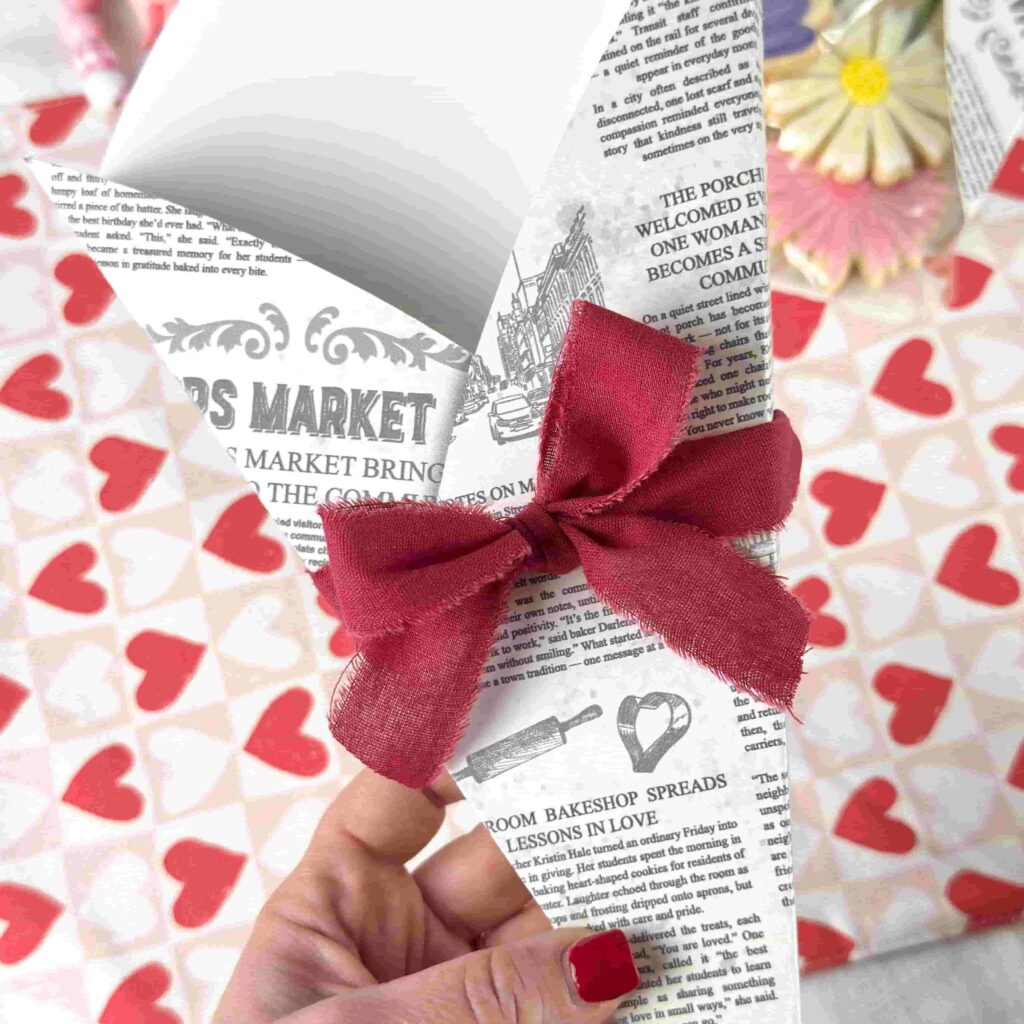 Tying a bow on a Cookie Flower Box