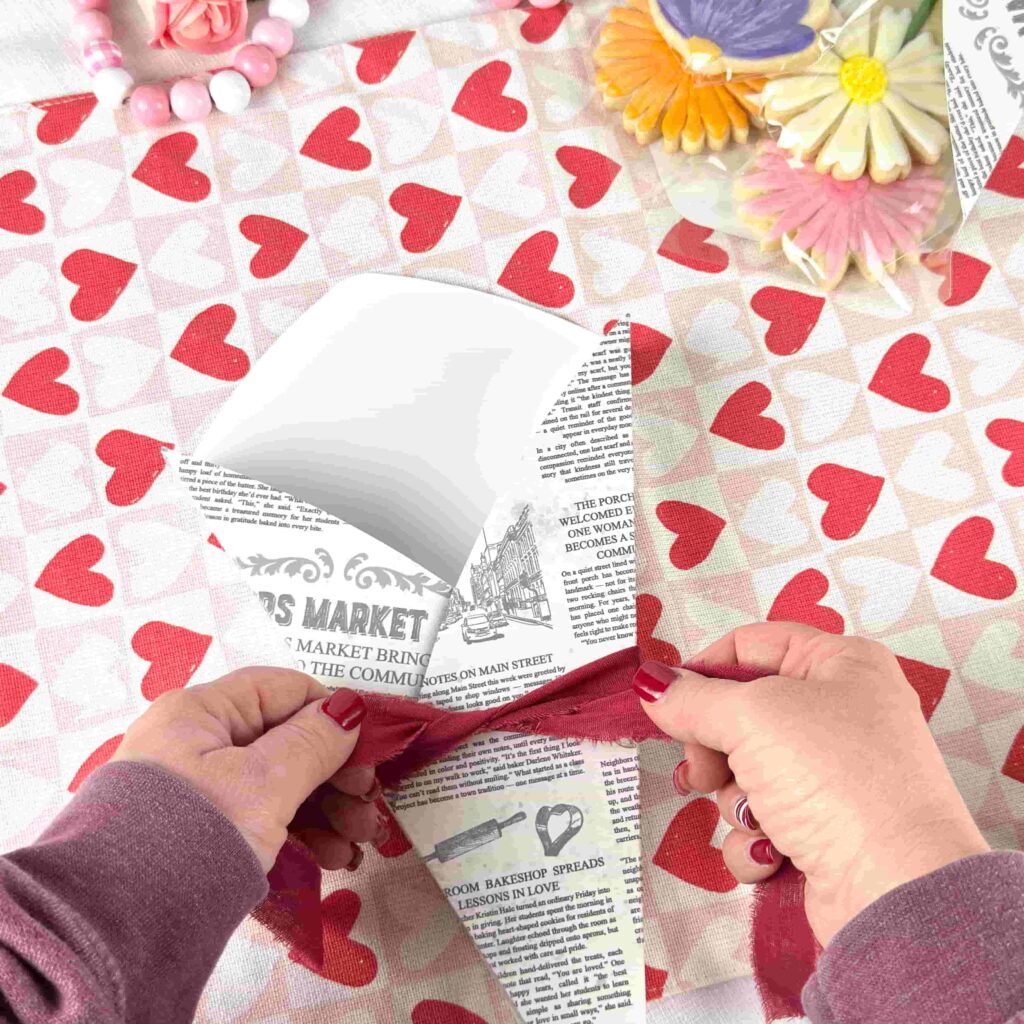 Tying a bow on a Cookie Flower Box