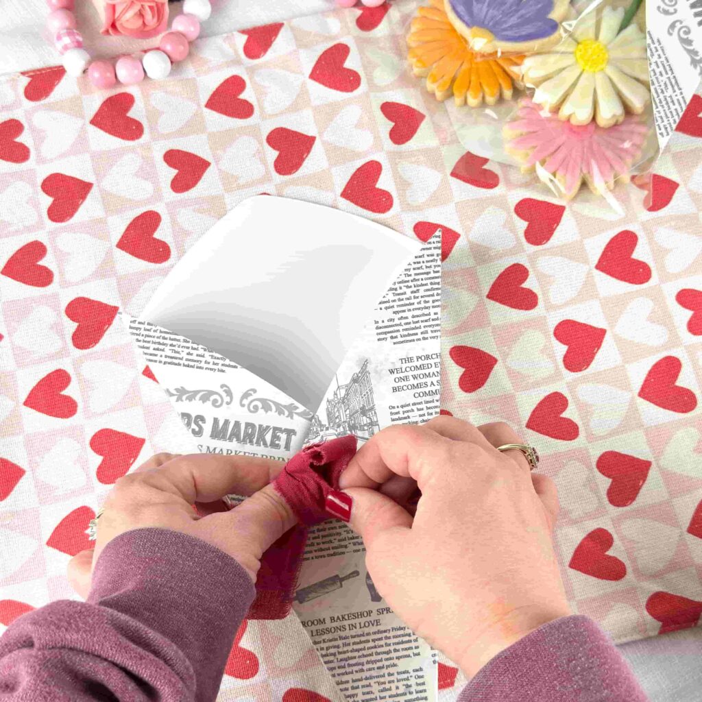 Tying a bow on a Cookie Flower Box