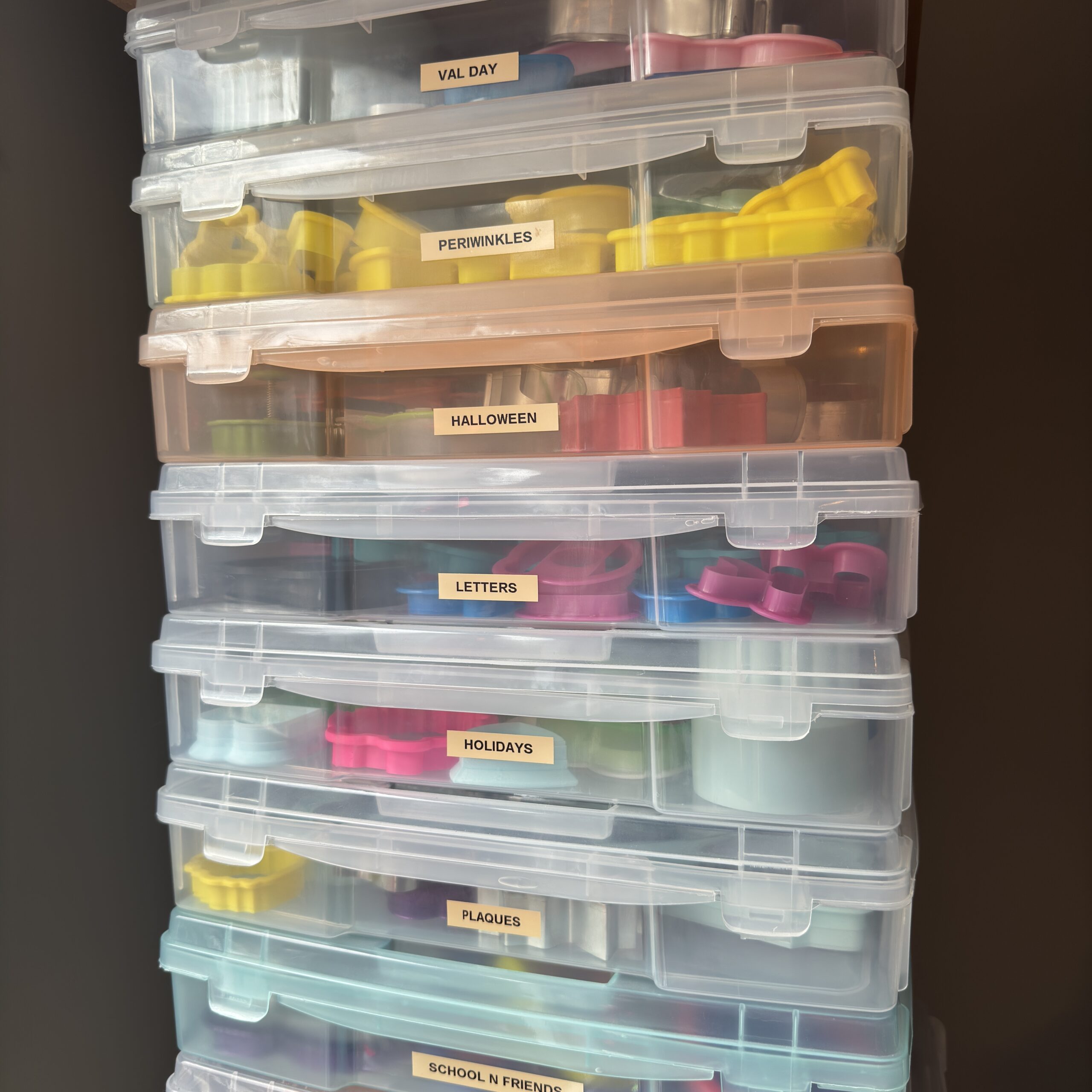 stacked bins with cookie cutters