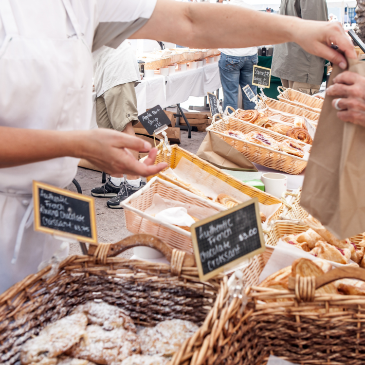 baker selling at market